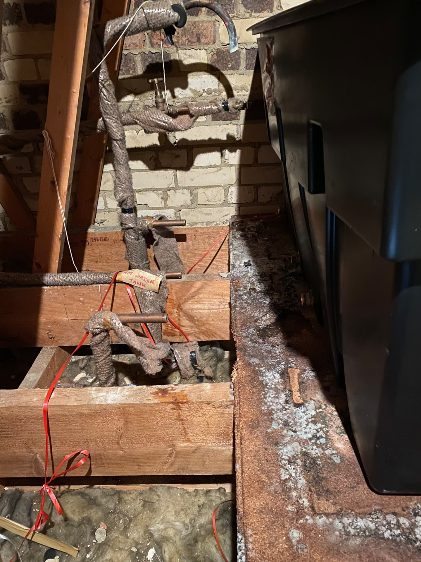 Old insulated cold water storage tank in a London loft