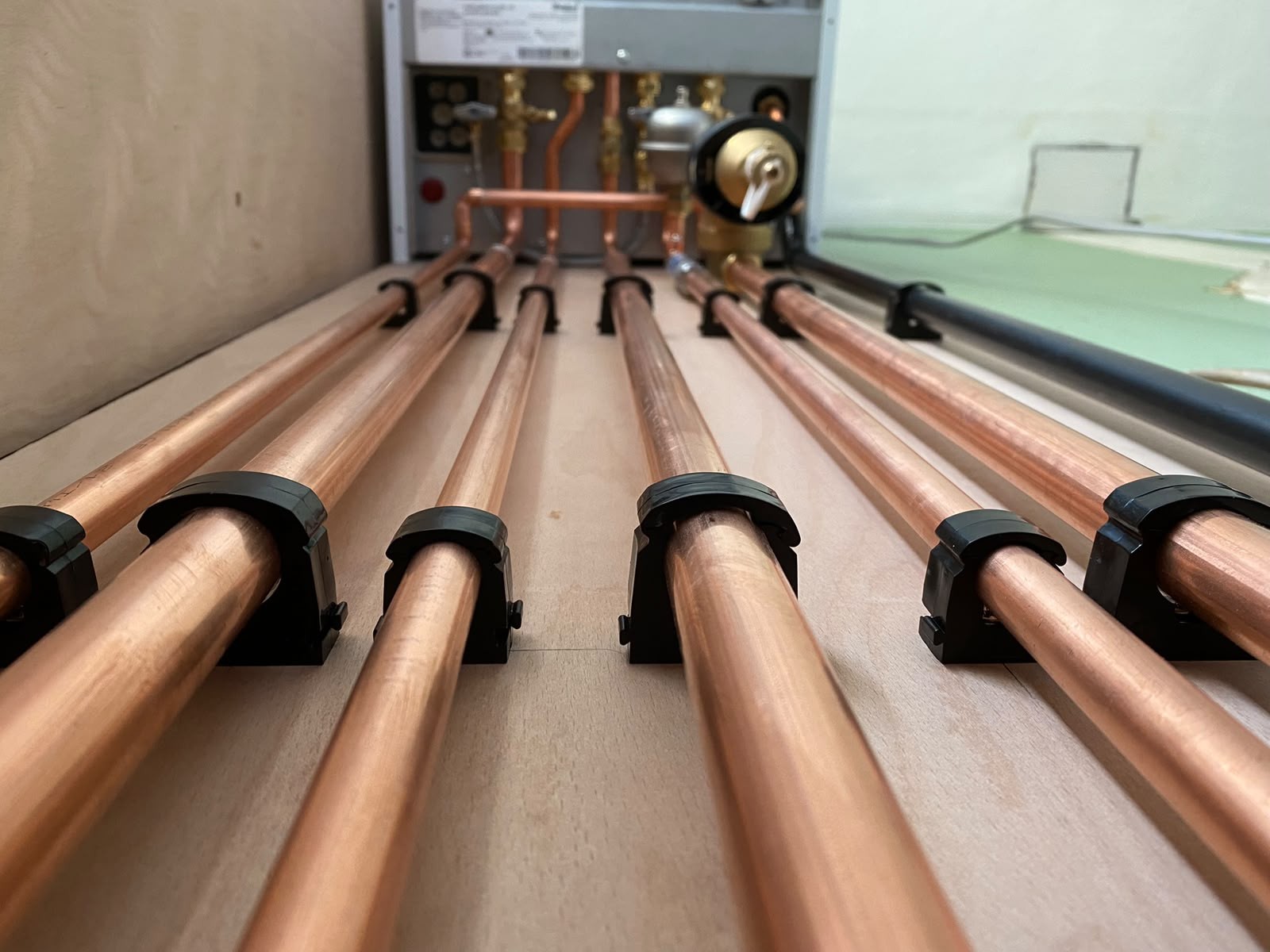 Central heating copper pipework run installed by Chelsea Plumbing in London