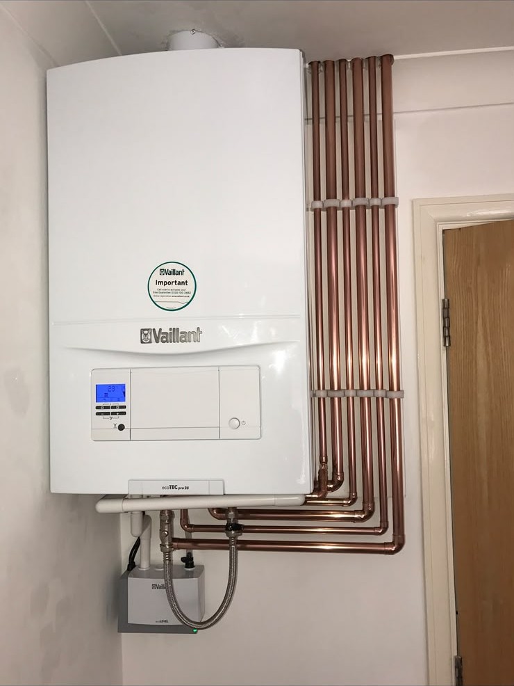 Vaillant combi boiler installation with vertical copper pipework in London