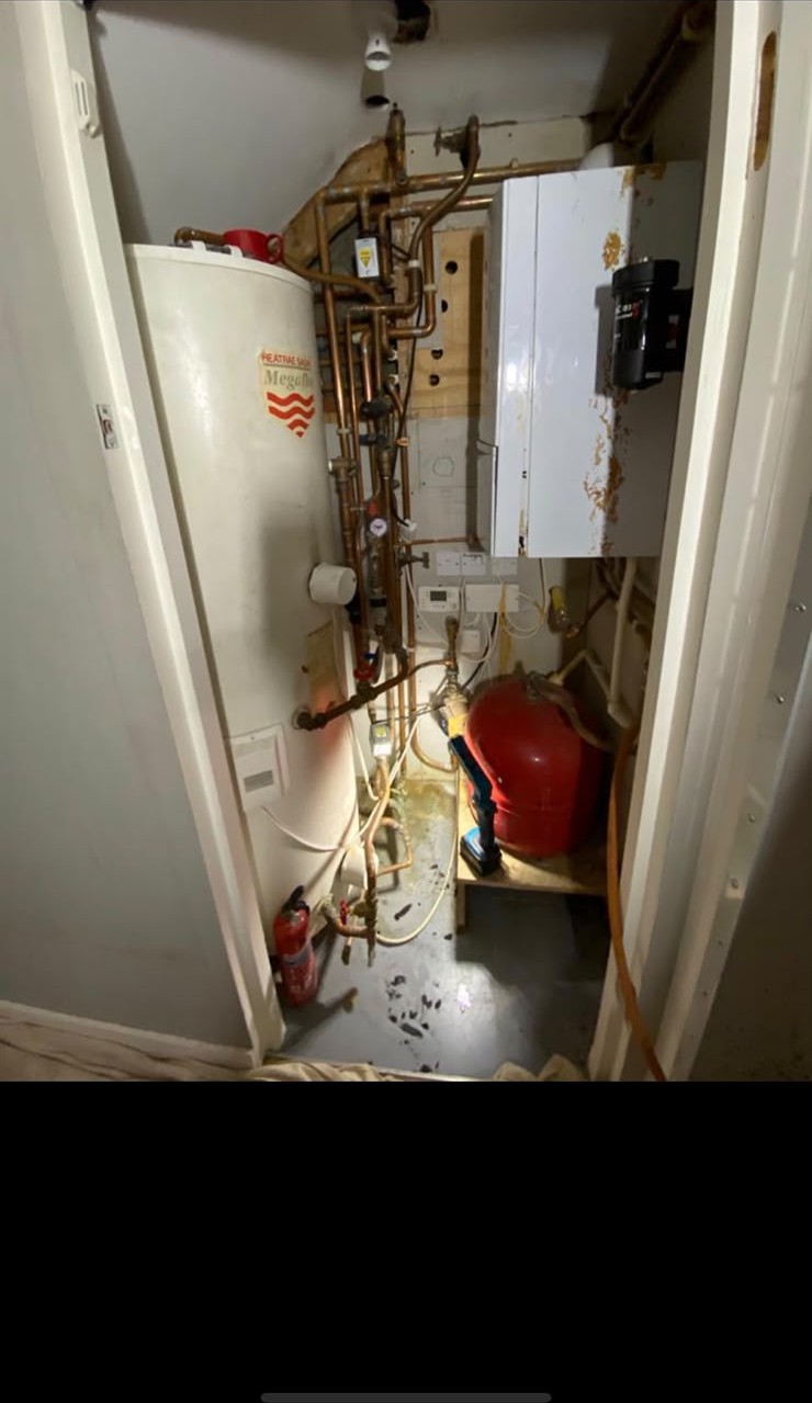 Old boiler and MegaFlo cylinder fault diagnosis in a London utility cupboard