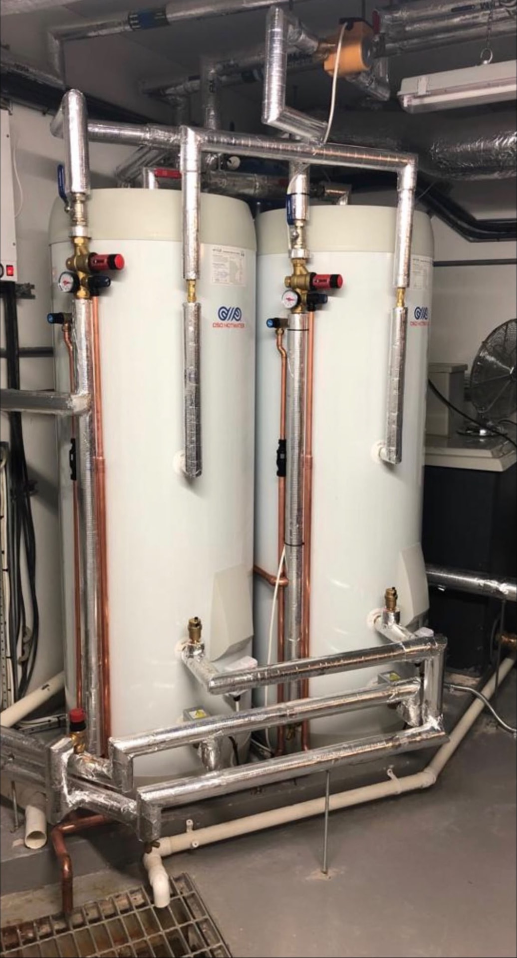 OSO twin unvented hot water cylinders installed in a London plant room