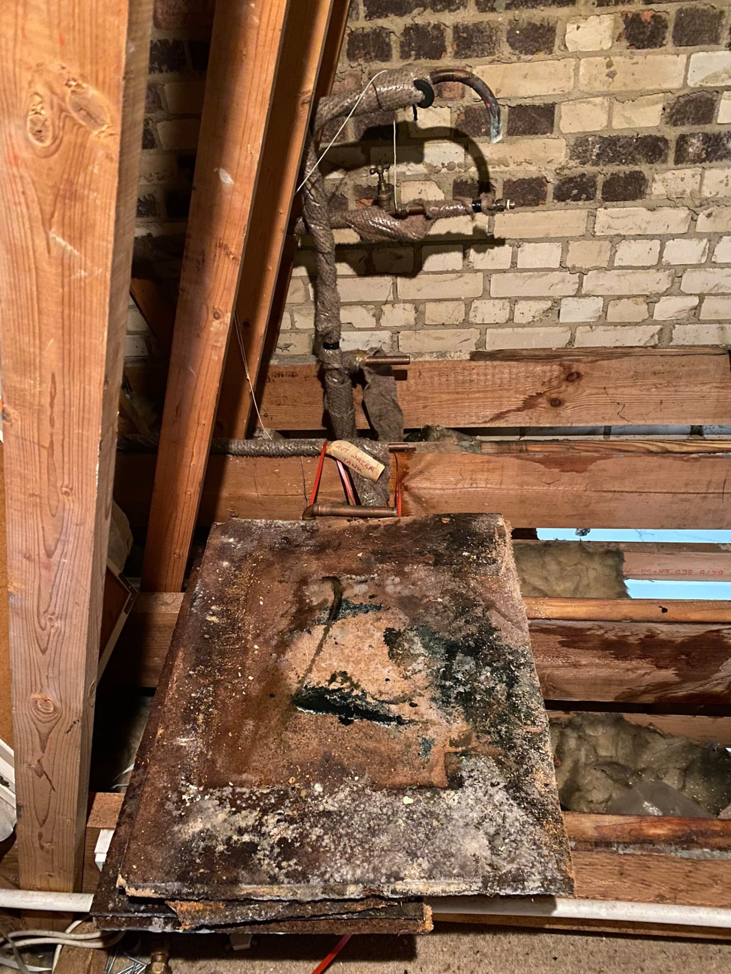 Loft space cleared after removal of an old water tank in London