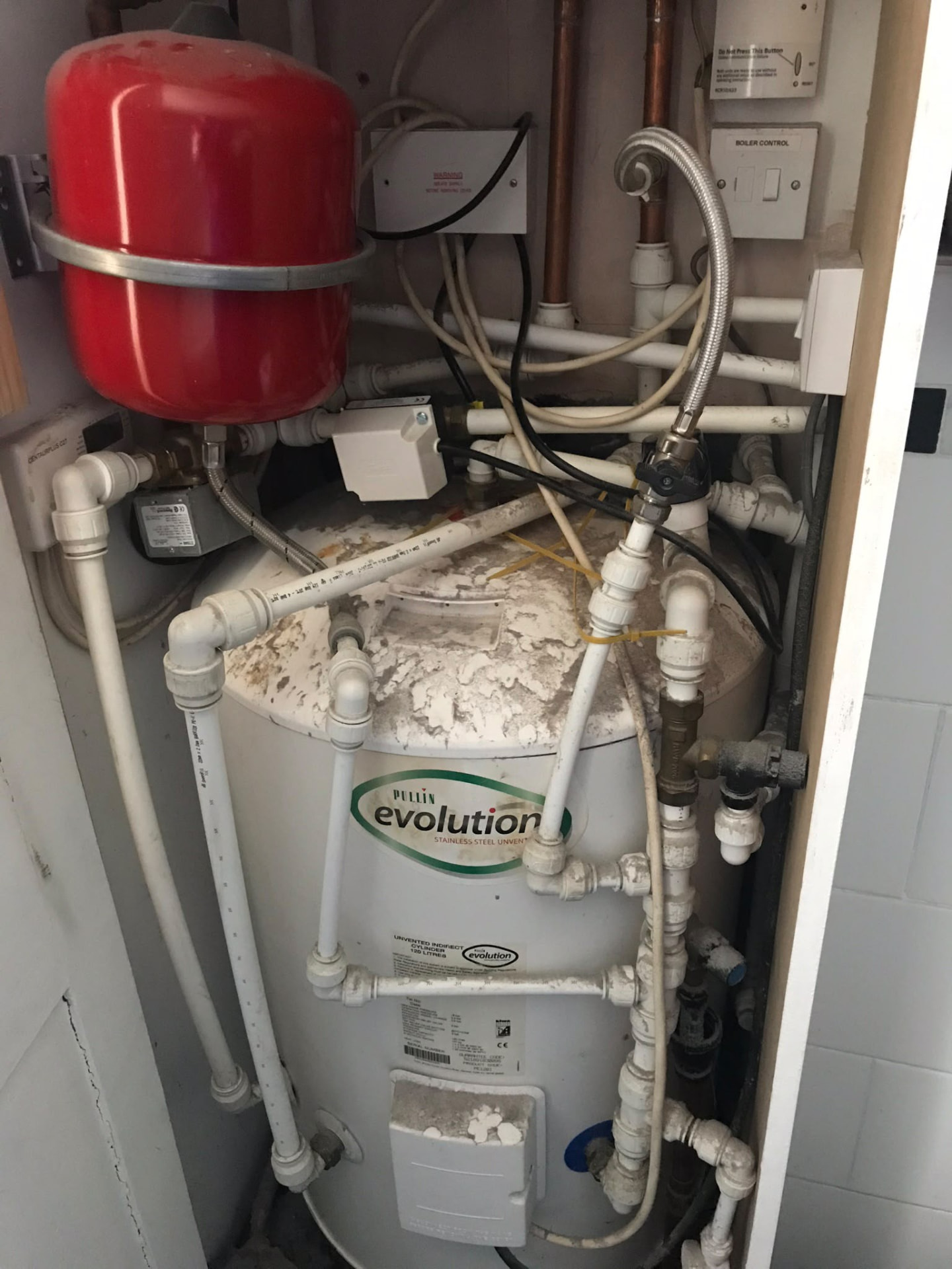 Existing unvented hot water cylinder installation surveyed for replacement in London